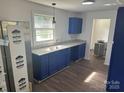 Bright kitchen with updated granite countertops, window view, and painted cabinets at 201 Harley St, Wadesboro, NC 28170