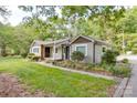 Charming single-story home with lush landscaping and a welcoming entrance at 20337 Nc Hwy 73 Hwy, Albemarle, NC 28001
