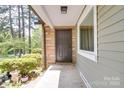 Charming front entrance with stone accents, neutral siding, and a welcoming covered porch area at 20337 Nc Hwy 73 Hwy, Albemarle, NC 28001