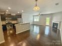 Open floorplan with a fireplace and hardwood floors at 2752 Sawbridge Ln, Gastonia, NC 28056