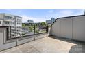 Rooftop balcony boasts city views and modern railings for stylish, outdoor living at 3223 Beans Blvd, Charlotte, NC 28203