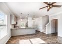 Open kitchen with modern gray cabinets, granite countertops, and stainless steel appliances at 338 Livingston Dr, Lancaster, SC 29720