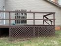 Exterior features a backyard deck with brown wood and white sliding glass doors at 3498 Yorkland Dr, Hickory, NC 28601