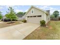 This home features a two car garage and long driveway at 4219 Mackinnon Dr, Charlotte, NC 28214