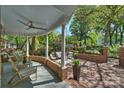 Inviting outdoor patio featuring brick paving, lounge area, and lush landscaping at 423 N Pine St, Charlotte, NC 28202