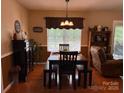 Cozy dining room features natural light, stylish furnishings, and hardwood flooring at 1025 Bee Line Ln, Salisbury, NC 28147
