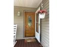Inviting front door area with hanging plants and a lovely hello door mat at 1025 Bee Line Ln, Salisbury, NC 28147