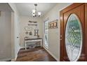 Welcoming foyer with hardwood floors and stylish decor accents at 105 Horsestable Ct, Mooresville, NC 28115