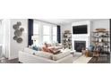 Bright living room with a fireplace, built-in shelving, modern decor, comfortable seating, and lots of natural light at 107 Nighthawk Trl # 21, Mooresville, NC 28115