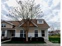 Inviting home with craftsman style windows and tan and white color scheme at 1156 Fowler Brook Ct, Indian Land, SC 29707