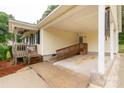 View of covered carport with access ramp and stairs leading to the home at 1215 Eastcreek Rd, Fort Lawn, SC 29714