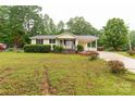 Charming single-story home with a covered front porch and a well-maintained front yard at 1215 Eastcreek Rd, Fort Lawn, SC 29714