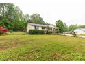 Cozy one-story house featuring a landscaped yard, providing a welcoming curb appeal at 1215 Eastcreek Rd, Fort Lawn, SC 29714