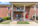 Charming brick townhouse with inviting balconies, offering a blend of classic and modern appeal at 123 Carriage House Dr, Kannapolis, NC 28081