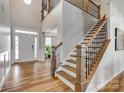 Grand foyer with hardwood floors, staircase, and natural light at 14925 Baldridge Dr, Huntersville, NC 28078