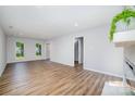 Spacious living room featuring hardwood floors and plenty of natural light at 1640 English Knoll Dr, Matthews, NC 28105