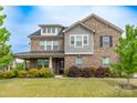 A beautiful two-story house displaying nice architectural details and landscaping at 16711 Monocacy Blvd, Huntersville, NC 28078