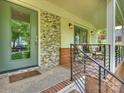 A welcoming porch with stylish furniture, offering an ideal space to unwind at 1733 Piccadilly Dr, Charlotte, NC 28211
