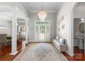 Elegant foyer with hardwood floors, stylish chandelier, and decorative accents at 3507 Governors Island Dr, Denver, NC 28037