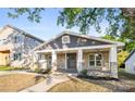 Craftsman style home with stone facade and inviting covered front porch at 415 Lakewood Ave, Charlotte, NC 28208