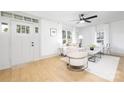 Open living room with light wood floors, and bright natural light at 415 Lakewood Ave, Charlotte, NC 28208