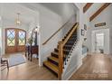 Stunning entryway showcasing a staircase with wood and metal accents, leading to the upper level of the home at 4316 Nesbit Rd, Monroe, NC 28112