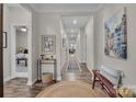 Inviting home hallway with hardwood floors, neutral walls, and decorative accents creating a warm, welcoming atmosphere at 5104 Samoa Ridge Dr, Lancaster, SC 29720