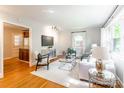Bright living room with hardwood floors, natural light, and modern decor at 6338 Rosecrest Dr, Charlotte, NC 28210