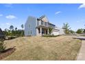 Expansive lawn surrounds this inviting two-story home, offering plenty of space for outdoor activities and relaxation at 8901 Powder Works Dr, Huntersville, NC 28078