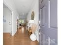 Inviting foyer showcases gleaming hardwood floors, and an open floor plan, creating a warm and welcoming ambiance at 8901 Powder Works Dr, Huntersville, NC 28078