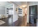 Hallway with hardwood floors, neutral paint, and decorative touches at 924 Forbes Rd, Fort Mill, SC 29707