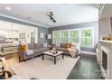 Cozy living room showcasing an open layout with kitchen access and natural lighting at 924 Forbes Rd, Fort Mill, SC 29707