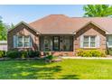 Beautiful home featuring brick facade, well-kept lawn, and vibrant flowerbeds at 1005 Spring Rock Dr, Salisbury, NC 28146