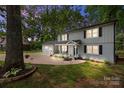 Exterior of charming two-story home with covered front porch, attached garage, and twilight sky at 130 Cherokee Ln, Salisbury, NC 28147