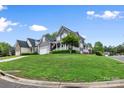 Charming two-story home with welcoming front porch, neutral siding, a two-car garage and a lush, sloped front yard at 1358 Colwick Ln, Rock Hill, SC 29732