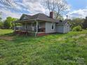 View of a charming single story home with a covered porch and well kept lawn at 1714 Measmer St, Kannapolis, NC 28081