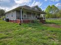 Charming single story home with a covered front porch and brick foundation at 1714 Measmer St, Kannapolis, NC 28081