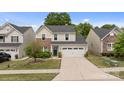 Inviting two-story home with a two-car garage, manicured lawn, and a welcoming front entrance at 176 Jennymarie Rd, Mooresville, NC 28115