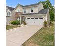 Traditional home with a two-car garage, manicured lawn, and neutral exterior colors at 176 Jennymarie Rd, Mooresville, NC 28115
