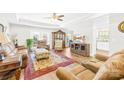 Bright and spacious living room with tray ceilings, hardwood floors and comfortable furnishings at 201 Churchill Dr, Kings Mountain, NC 28086