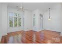 Spacious living room bathed in natural light, showcasing hardwood floors and elegant crown molding at 2810 Selwyn Ave # 410, Charlotte, NC 28209