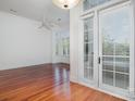 Bright living room enhanced by natural light and hardwood floors, leading to a charming outdoor space at 2810 Selwyn Ave # 410, Charlotte, NC 28209