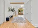 Spacious foyer features double doors, a bench, coat closet, stairs, and natural light at 3505 Trent St, Charlotte, NC 28209