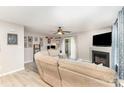 Inviting living room with a fireplace, ceiling fan, and sliding glass doors to the exterior at 5257 Glenlea Walk Ln, Charlotte, NC 28216