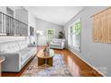 Bright living room with vaulted ceilings, hardwood floors, and large windows at 5486 Suttlemyre Ln, Hickory, NC 28601