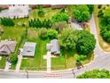Aerial view of home with well-maintained lawn, driveway, and mature trees surrounding the property at 704 E Catawba St, Belmont, NC 28012