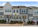 Well-maintained townhome with lovely landscaping, steps to door, and neutral color scheme at 131 Berkeley Ave # D, Mooresville, NC 28117