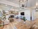 Inviting living room with brick fireplace, wood floors, modern lighting, and stylish decor at 1525 Shinnville Rd, Cleveland, NC 27013