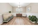 Neutral dining room featuring wood floors, wainscoting and stylish decor at 2158 Winhall Rd, Fort Mill, SC 29715