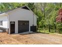 The property features a detached two-car garage with a private entrance and plenty of parking at 221 Belton Ave, Mount Holly, NC 28120